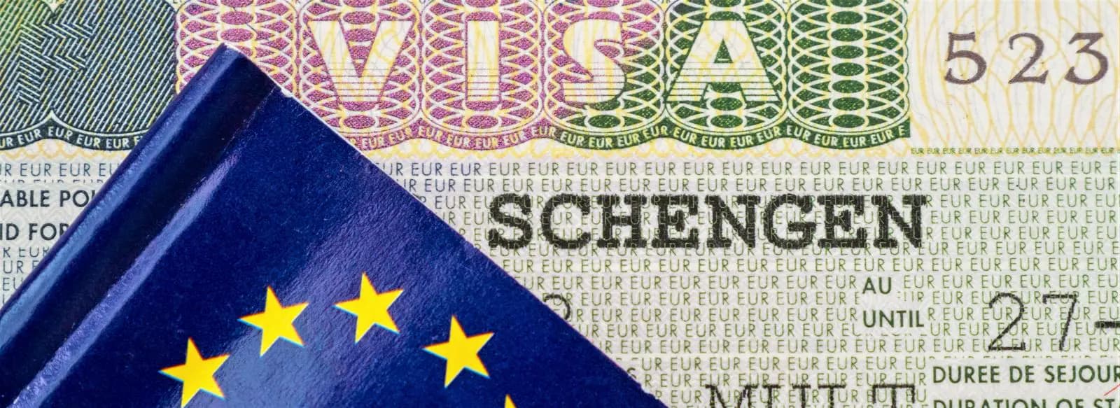 EU flag on top of a Schengen visa.