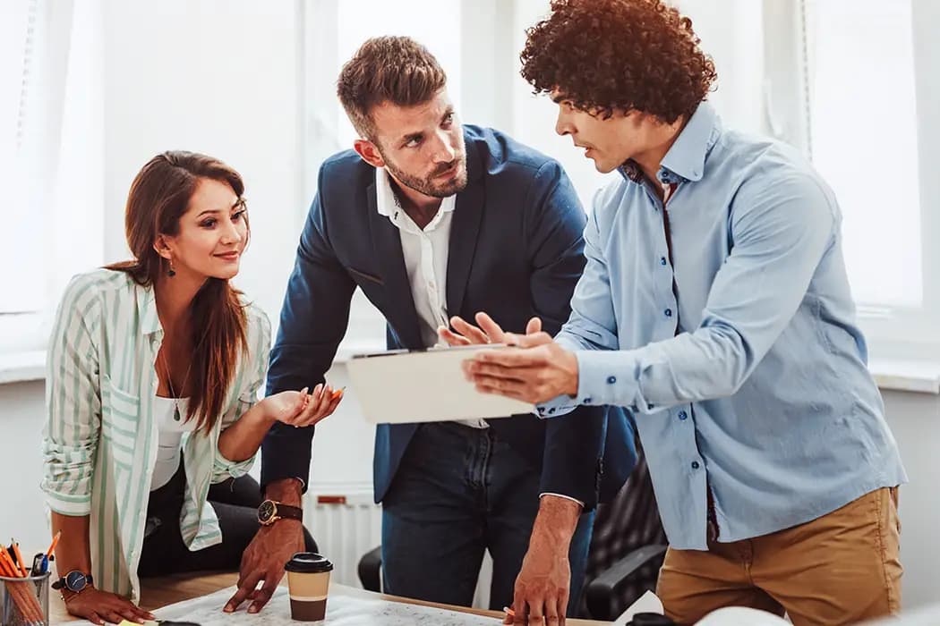 A confident young entrepreneur presenting their business pitch to potential investors in a boardroom.
