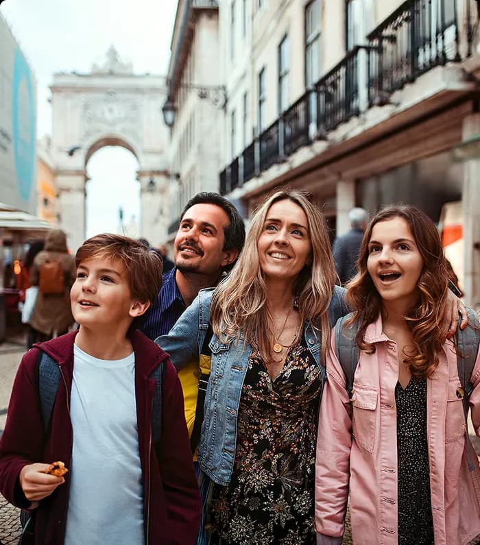 family of 4 walking in Lisbon's downtown Rua Augusta