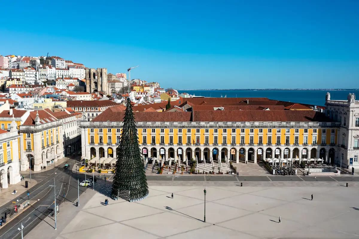 Sunny day in Lisbon, with blue skies, during the winter, in Praça do Comércio.