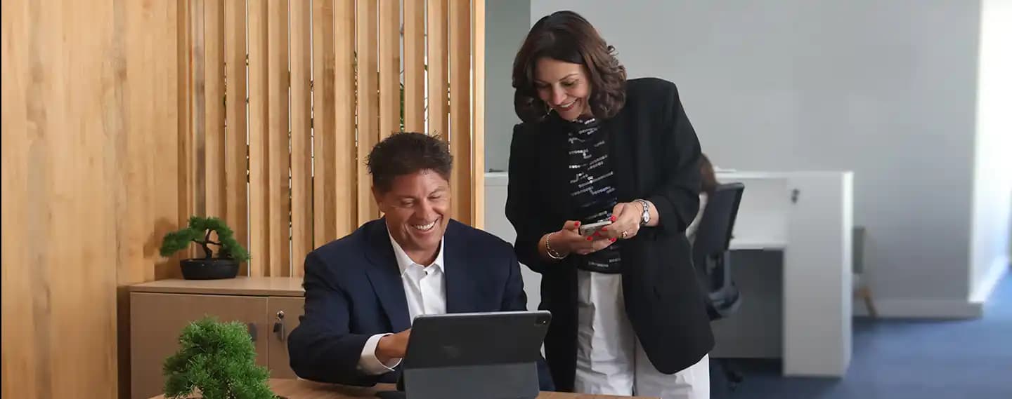 Team working together at Portugal Homes office, part of Harland & Poston Group