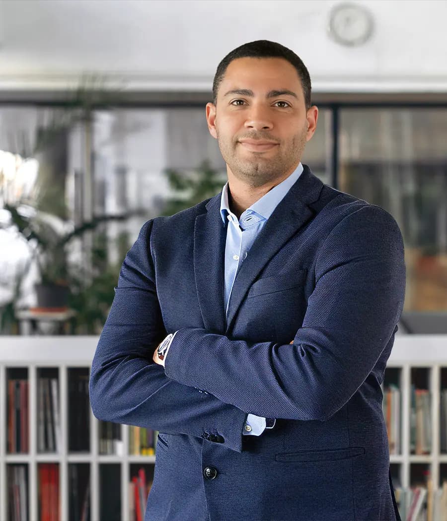 Real estate advisor in an office, supporting clients buying property in Portugal