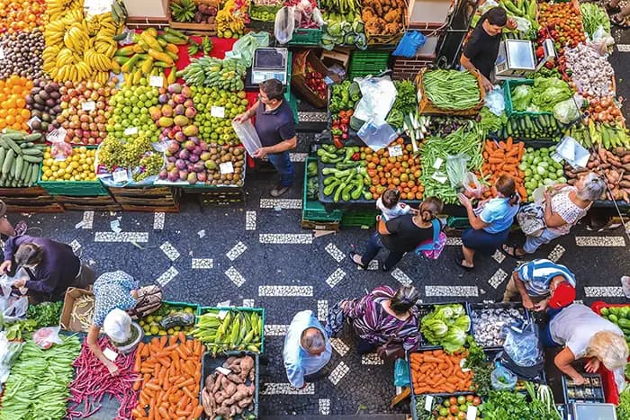 A top-down view of the colourful 'Lavradores' market in Funchal, Madeira.